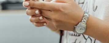 Image of a student holding a cell phone