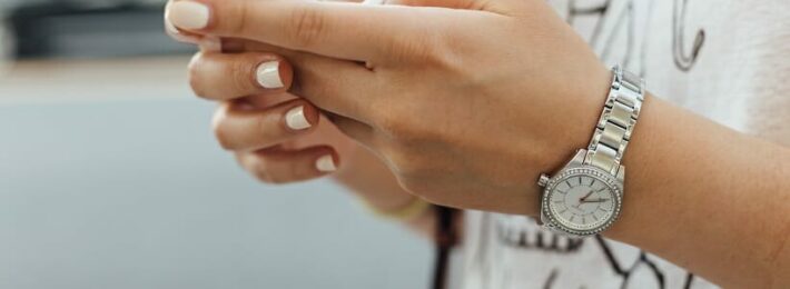 Image of a student holding a cell phone