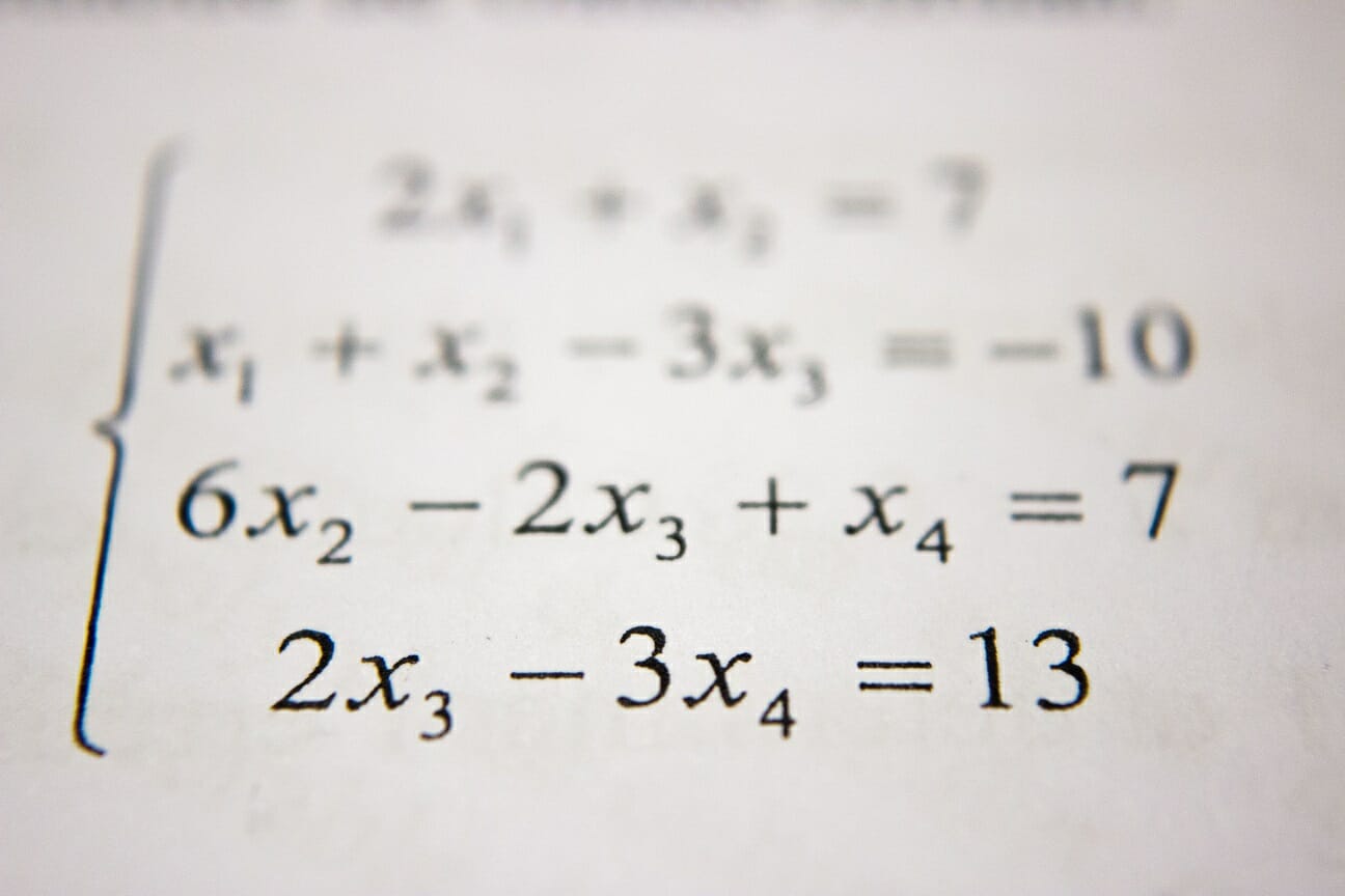 Remedial Math and Developmental Education: Image of an equation on a whiteboard