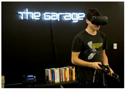 Makerspaces and Academic Incubators: A student using a virtual reality headset at the Garage