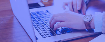 person typing on a laptop