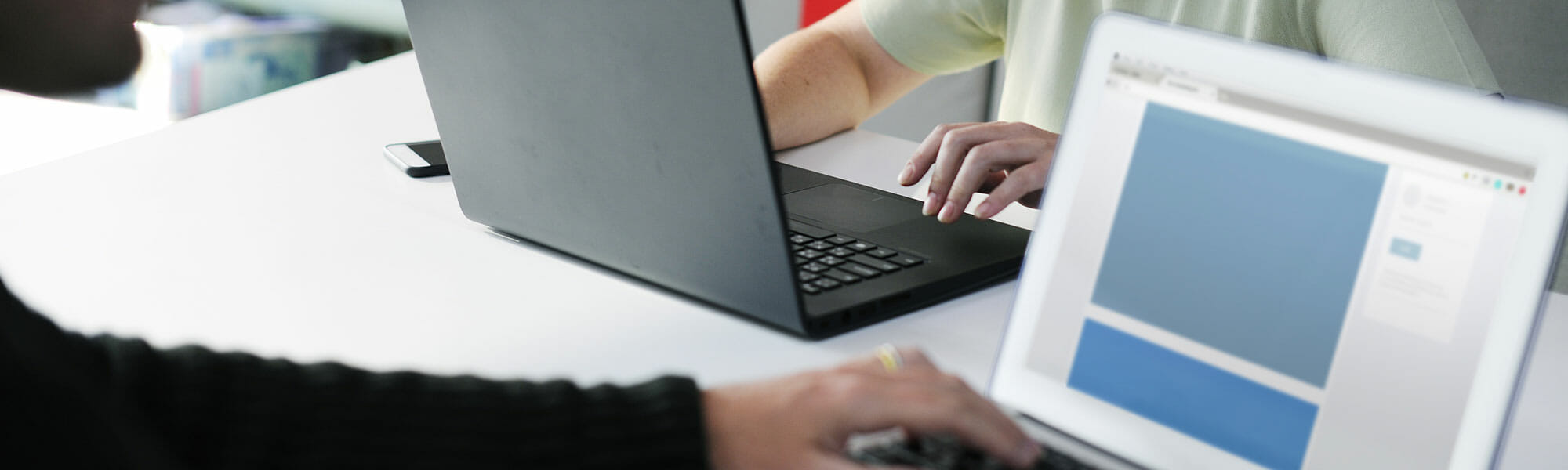 person typing on a laptop