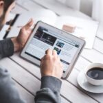 man reading a video course on a tablet