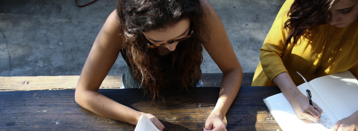 two people working together on an assignment