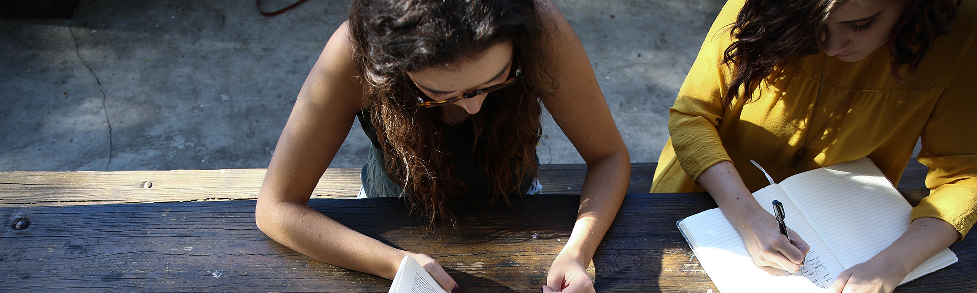 two people working together on an assignment