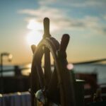 wheel of a ship in the sunset