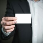 person holding a blank business card