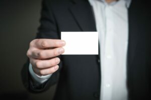 person holding a blank business card