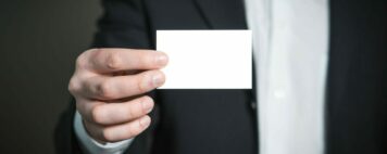 person holding a blank business card
