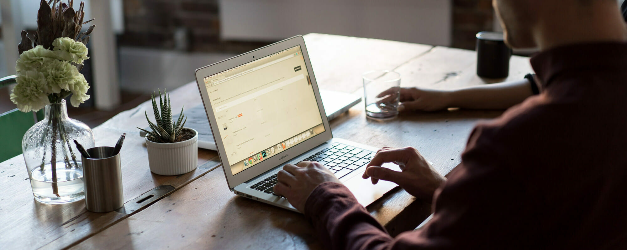 person typing on a laptop