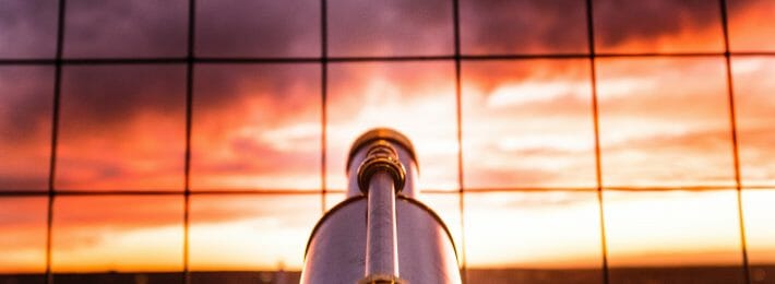 Looking Beyond Our Borders, Hiring Staff From Outside Higher Ed: Image shows a telescope pointed at the horizon