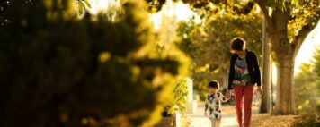 Title IX Reasonable Accommodations - Student Parent Walking with a Child on a Sidewalk