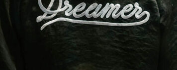 Black jacket with Dreamer written on the back