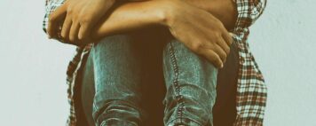 Sad woman hug her knee