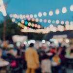 blurred background at night event, people walking around