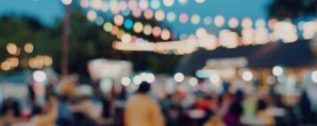 blurred background at night event, people walking around