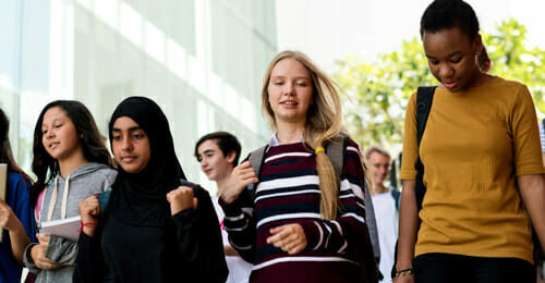 Image of a diverse group of students walking