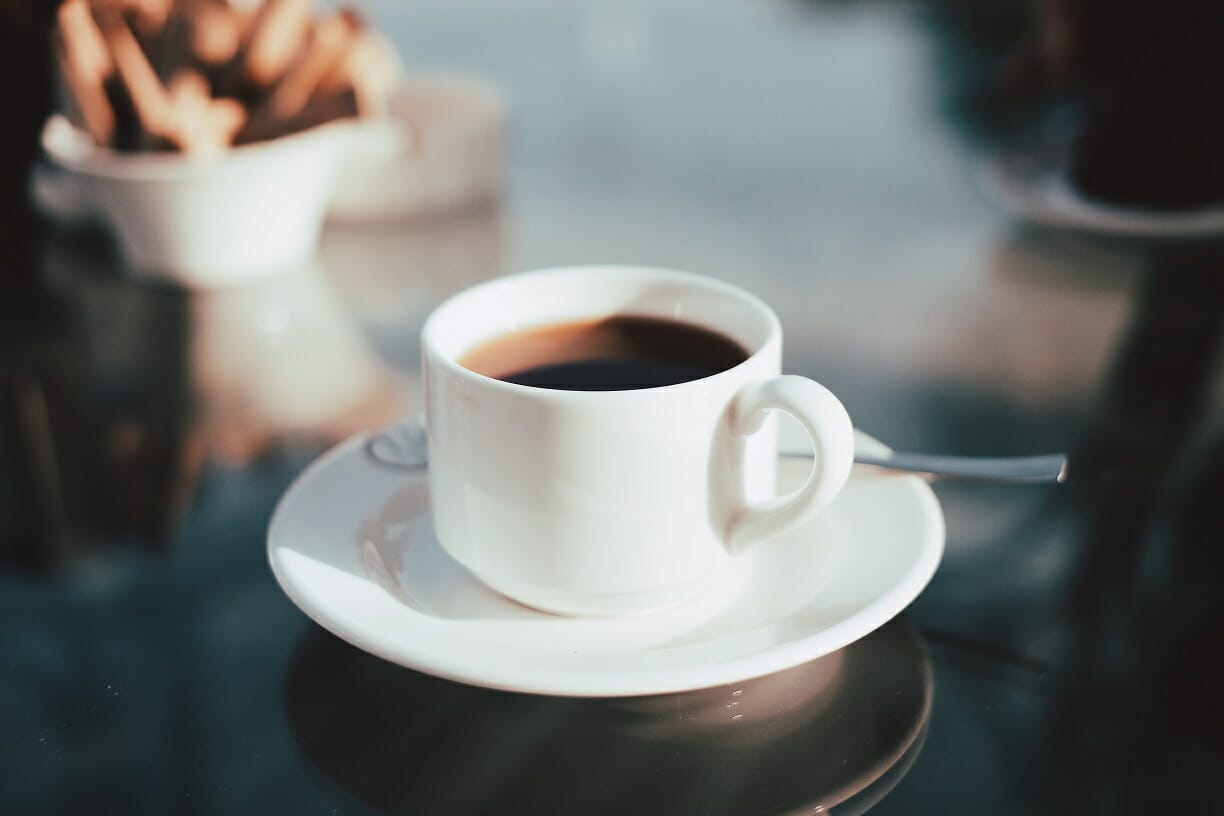 360° Feedback - Image of sitting down to listen with a cup of coffee