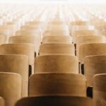 When the University President Exits Abruptly - Image of Empty Lecture Hall Chairs