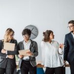 Business People standing in the office discuss