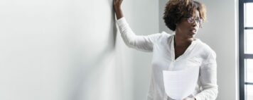 Woman writing on a whiteboard