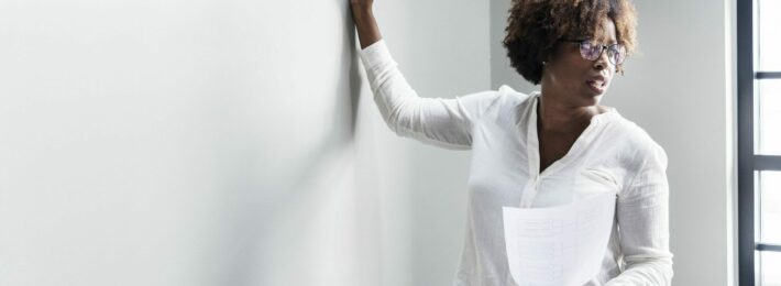 Woman writing on a whiteboard