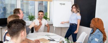 Group of project managers in higher education watching presentation