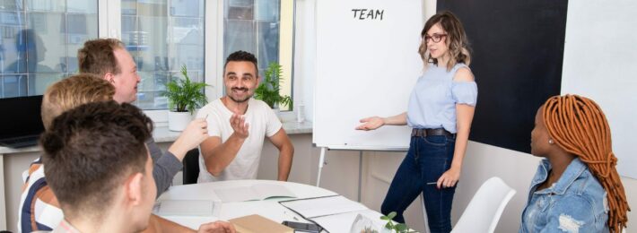 Group of project managers in higher education watching presentation