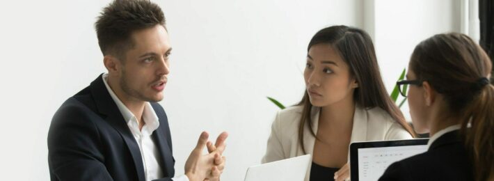 3 people having a serious conversation