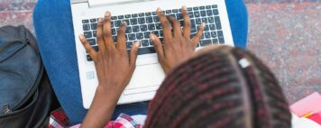 Typing on laptop