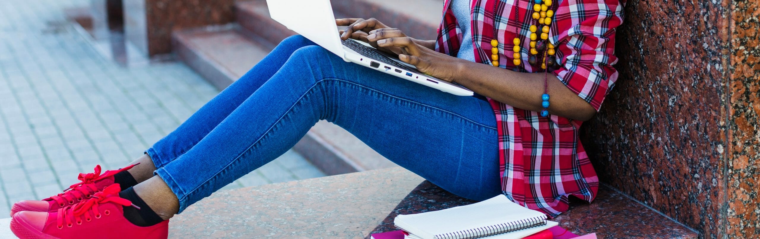 Student sitting with laptop