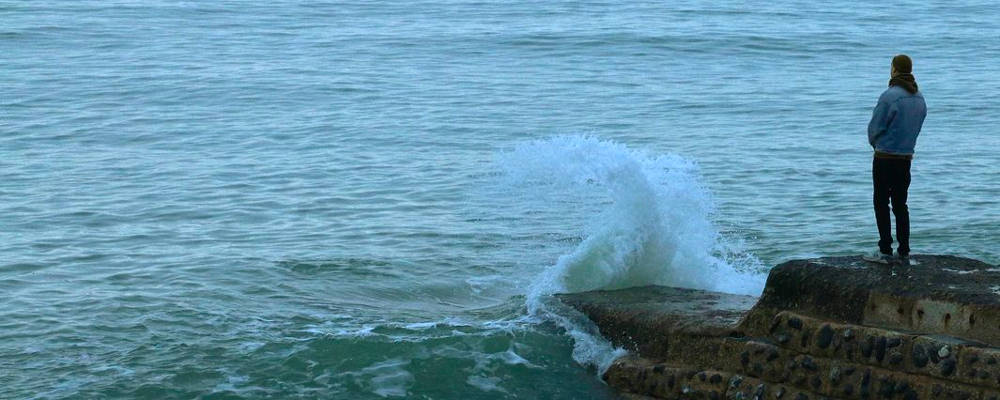 crisis Person looking out at sea