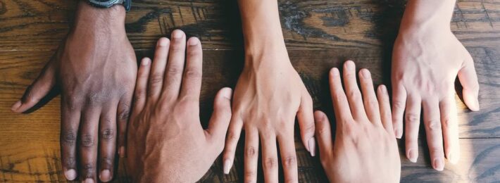 Photo of hands with diverse skin tones