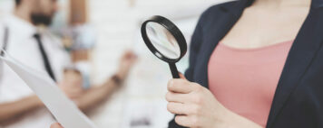 woman holding a magnifying glass