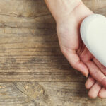 Woman holding heart shape in her hands