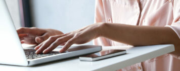 Woman typing on computer