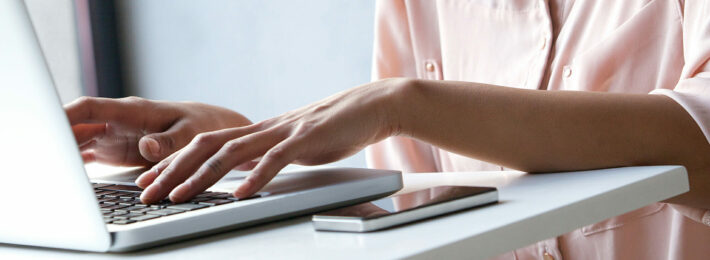 Woman typing on computer