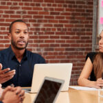 Professionals at a roundtable meeting