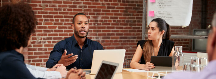 Professionals at a roundtable meeting