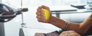 Stressed professional squeezing a ball