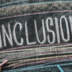 Inclusion written on chalkboard