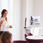 Female instructor giving a lecture in a classroom