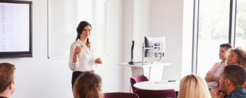 Female instructor giving a lecture in a classroom