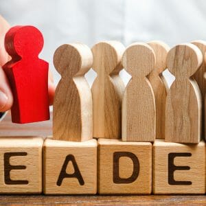 Leader spelled out on wooden blocks