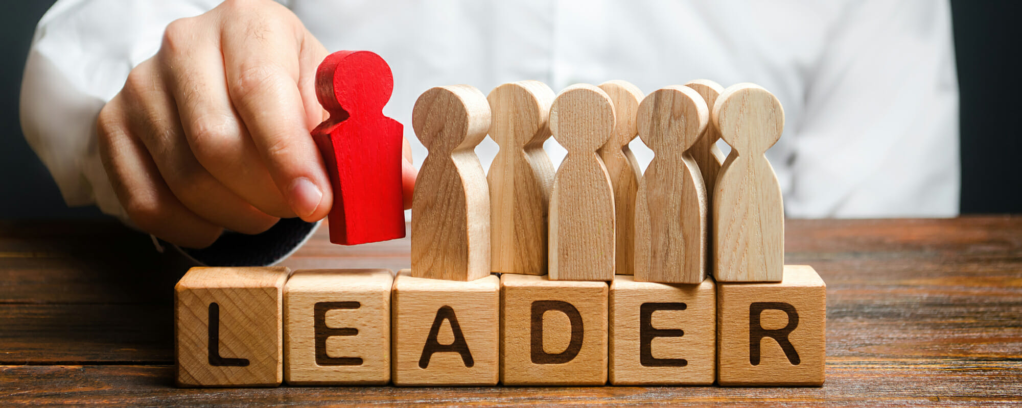 Leader spelled out on wooden blocks