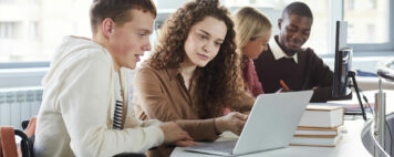 Diverse group of college students learning