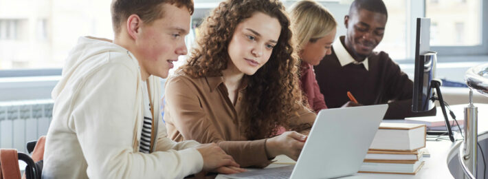 Diverse group of college students learning