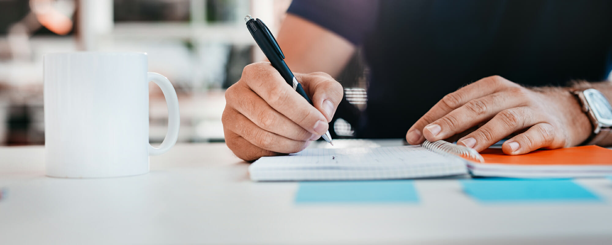 Man writing in a notebook