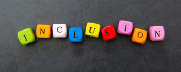 Colorful blocks spelling inclusion