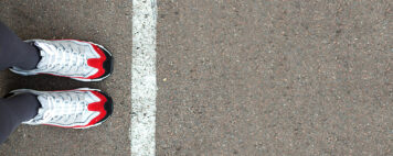 Person standing near a dividing line